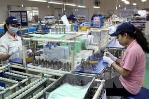 The Vietnam Business Summit enables domestic and overseas enterprises to share information regarding trade and integration trends and cooperation experience in Vietnam and the Asia-Pacific region (Photo VNA)