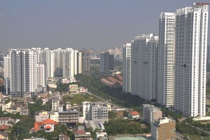 Buildings along Nguyen Huu Tho street in District 7 and Nha Be, HCMC (Photo: SGGP)
