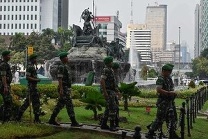 Indonesian soldiers patrol near the constitutional court in Jakarta on Jun 14, 2019, as the court hears a defeated presidential challenger's claim that Indonesia's 2019 election was rigged, allegations that spawned deadly rioting last month. (Photo: AFP)