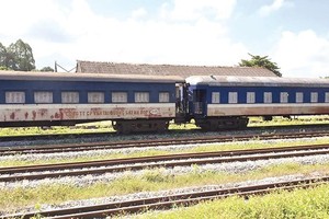 A corner of Kep station in Lang Giang, Bac Giang province with old coaches and rails