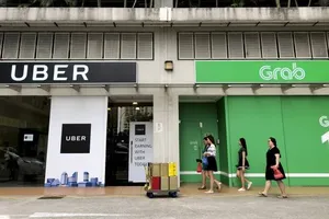 Uber sẽ có 27,5% cổ phần sau sáp nhập vào Grab. Nguồn: AP