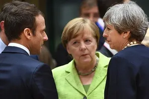 Từ trái qua: Tổng thống Pháp, Thủ tướng Đức và Thủ tướng Anh muốn bảo vệ thỏa thuận hạt nhân Iran. Ảnh: AP