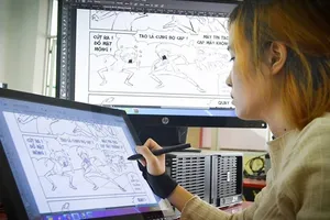 Thị trường truyện tranh Việt đang mở ra nhiều cơ hội cho các họa sĩ trẻ (một họa sĩ đang vẽ truyện tranh trên máy tính)   Ảnh: C.M.A.