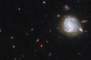 Kính viễn vọng không gian Hubble cho thấy GNz7q  là chấm đỏ. Ảnh : NASA