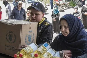 Một gia đình ở Syria nhận trợ cấp lương thực hàng tháng từ Chương trình Lương thực Thế giới (WFP). Ảnh : WFP