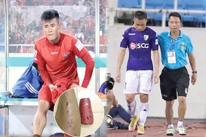 Tiền vệ Anh Hùng (trái) rất đau đớn sau pha “triệt hạ” của Sầm Ngọc Đức. Ảnh: CTV