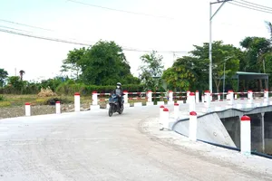 Cầu Suối Thị vừa được đưa vào sử dụng. Ảnh: QUANG NHÂN