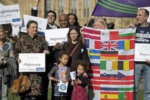 European workers including nurses, social workers and teaching assistants demonstrate outside the Houses of Parliament in London on February 20, before lobbying members of Parliament over their right to remain in the UK. - AFP/VNA Photo 