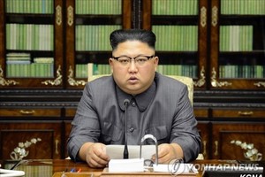 This photo carried by North Korea's state news agency on Sept. 22, 2017 shows North Korean leader Kim Jong-un reading his statement condemning U.S. President Donald Trump for threatening to "totally destroy" the North. (For Use Only in the Republic of Kor
