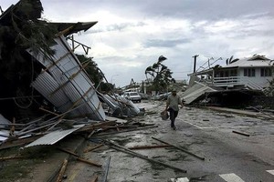 Flooding and damage in Tonga’s capital of Nuku’alofa after Cyclone Gita hit the country. — AFP/VNA Photo 