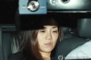The photo, filed May 2, 2018, captures Cho Hyun-min, an heiress to Korean Air Lines Co., inside a car on her way back from the Seoul Gangseo Police Station after undergoing a police questioning over assault allegations. (Yonhap)