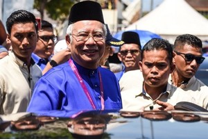 Malaysia’s Prime Minister Najib Razak smiles as he leaves after submitting his documents at the nomination centre in Pekan on April 28, 2018. Malaysia’s 14th general election is held on May 9 with nominations taking place on April 28. — AFP/VNA Photo