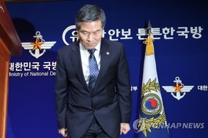 Defense Minister Jeong Kyeong-doo bows his head to apologize over sexual assaults by troops during their crackdown on a pro-democracy uprising in the southwestern city of Gwangju in 1980, during a press conference at the ministry's building in Seoul on No