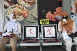 Người dân tại Jakarta, Indonesia. Ảnh: TTXVN