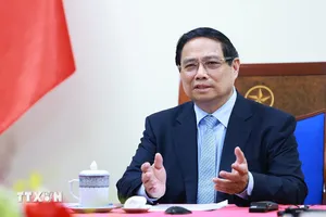 Thủ tướng Phạm Minh Chính điện đàm với Thủ tướng Malaysia Anwar Ibrahim. Ảnh: TTXVN