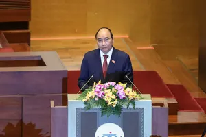 Chủ tịch nước Nguyễn Xuân Phúc trình phê chuẩn miễn nhiệm Phó Chủ tịch và một số Ủy viên Hội đồng Quốc phòng và An ninh. Ảnh: QUANG PHÚC