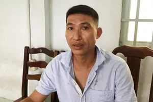 Đối tượng Nguyễn Quang Minh tại cơ quan công an. Ảnh: CHÍ THẠCH