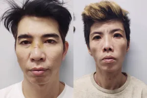 Hai vợ chồng Hoàng Long - Anh Thảo (từ trái qua phải) tại cơ quan công an