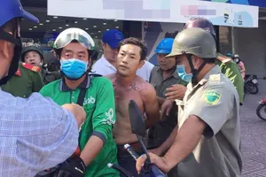 Nghi phạm bị công an bắt giữ. 