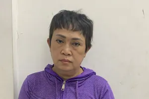 Đối tượng Trần Thị Lượm tại cơ quan công an. Ảnh: C.T