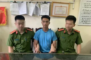 Triệu Quân Sự bị áp giải về trụ sở công an vào chiều 1-6. Ảnh: BCA