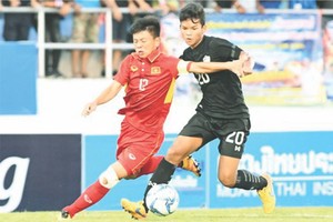 越南（紅衣）對泰國比賽一瞥。（圖片來源：互聯網）