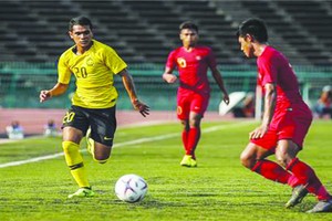 馬來西亞隊（黃衣）與緬甸隊比賽一瞥。