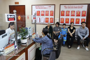 两级地方政府模式获得民群和企业的支持。图自越通社