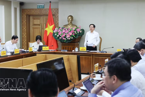 政府副总理胡国勇主持会议。图自越通社