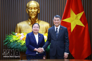 越南政府总理黎明兴会见老挝人民革命党中央组织部部长西赛·勒德门松。图自越通社