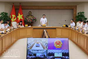 越南政府副总理阮文胜主持召开国际金融中心执行委员会会议。图自越通社