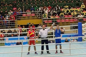 Nguyễn Văn Đương (xanh) đã có kỳ Đại hội thể thao toàn quốc thành công. Ảnh: N.V.Đ