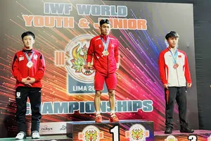 Lực sỹ K'Dương đã thi đấu để có tấm HCV đầu tiên cho cử tạ trẻ Việt Nam tại Lima (Peru). Ảnh: MINH MINH