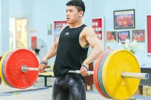 Trịnh Văn Vinh hướng vào hạng cân 65kg ở thời điểm hiện tại. Ảnh: LƯỢNG LƯỢNG