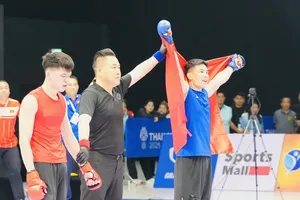 Tuyển thủ Quàng Văn Minh (xanh) từng lên ngôi vô địch tại SEA GAmes 33-2025. Ảnh: DŨNG PHƯƠNG