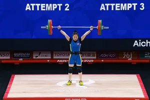 Lực sĩ Quàng Thị Tâm thi đấu hạng cân 57kg nữ tại ASIAD 20. Ảnh: PHÙNG CƯỜNG