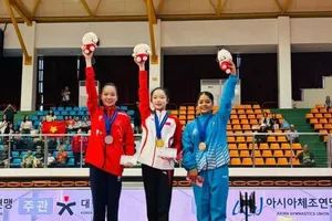 Nguyễn Thị Quỳnh Như (áo đỏ) là gương mặt số 1 của TDDC nữ Việt Nam thời điểm này. Ảnh: Q.NHƯ