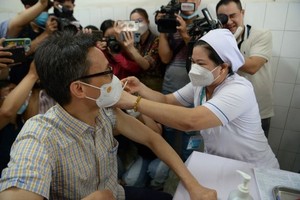Covid-19 might recur if people neglect vaccination: Deputy PM Vu Duc Dam