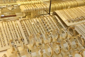 Domestic gold prices hit new record high