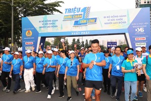 Nearly 10,000 join walk to raise funds for underprivileged laborers