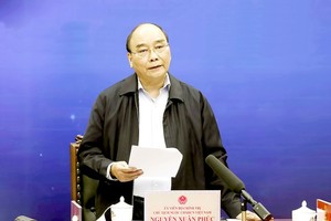 State President Nguyen Xuan Phuc is delivering his speech in the meeting. (Photo: Vietnam News Agency)
