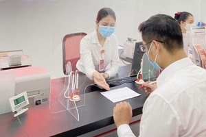 A transaction is being carried out in a bank