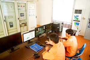 An EVN employee is monitoring safe electricity operation 
