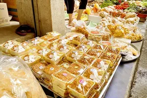 Unclear-origin mooncakes are displayed for sale at a market in HCMC