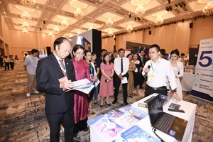 The organization board is visiting technology booths in the exhibition area