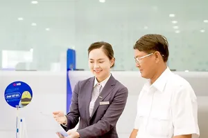 MB is offering the app mSeller free of charge to help household businesses manage their money flow more effectively (Photo: SGGP)