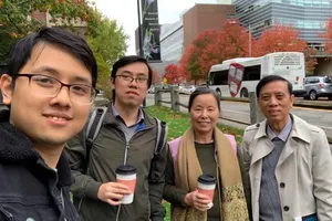 Prof Hoang Van Kiem and his wife with their two sons, Dr Hoang Trong Nghia (second on the left) and Dr Hoang Quang Minh (Photo: SGGP)