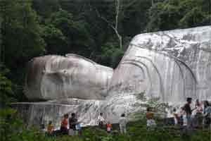 Atop a Mountain, a Smile Radiates Peace