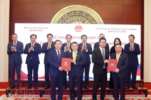 越南与中国企业互相交换合作谅解备忘录。