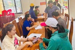 引导民众安装和适用VNeID应用程序。图自越通社